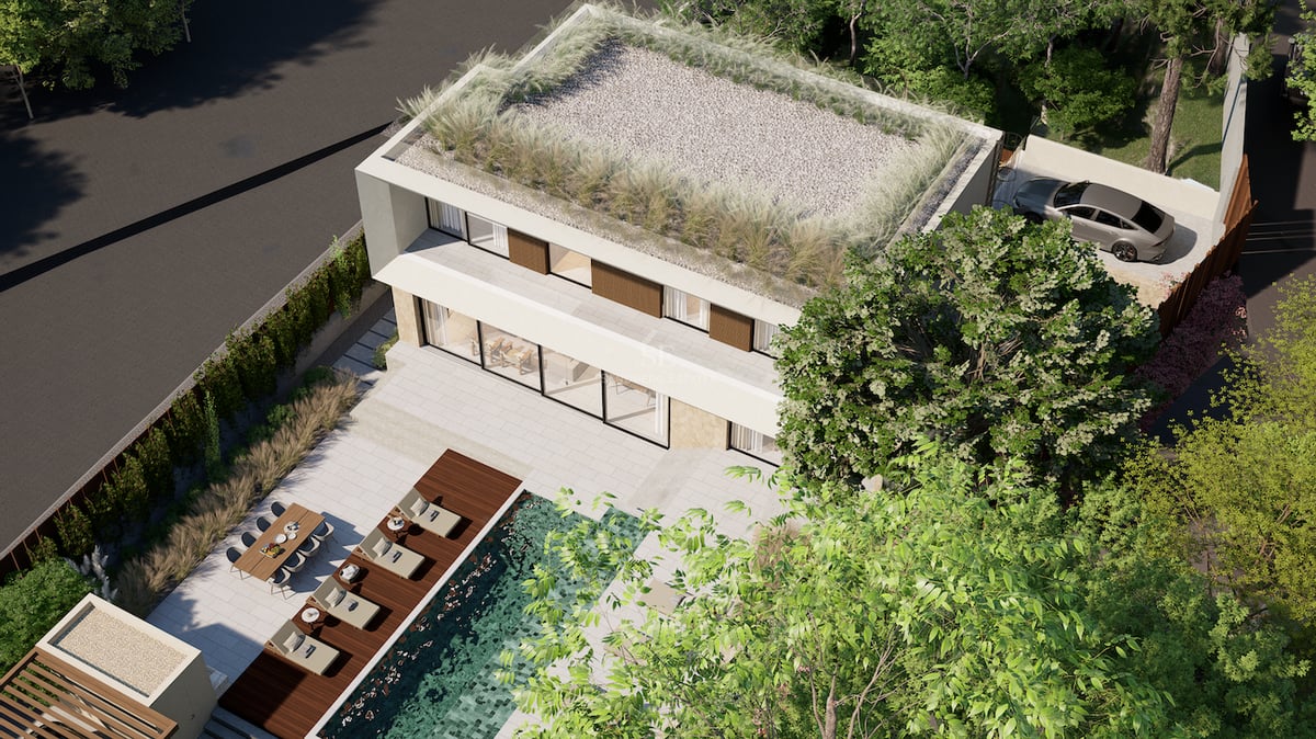 Vue aérienne d'une villa blanche contemporaine avec toit végétalisé, piscine turquoise et terrasse aménagée.