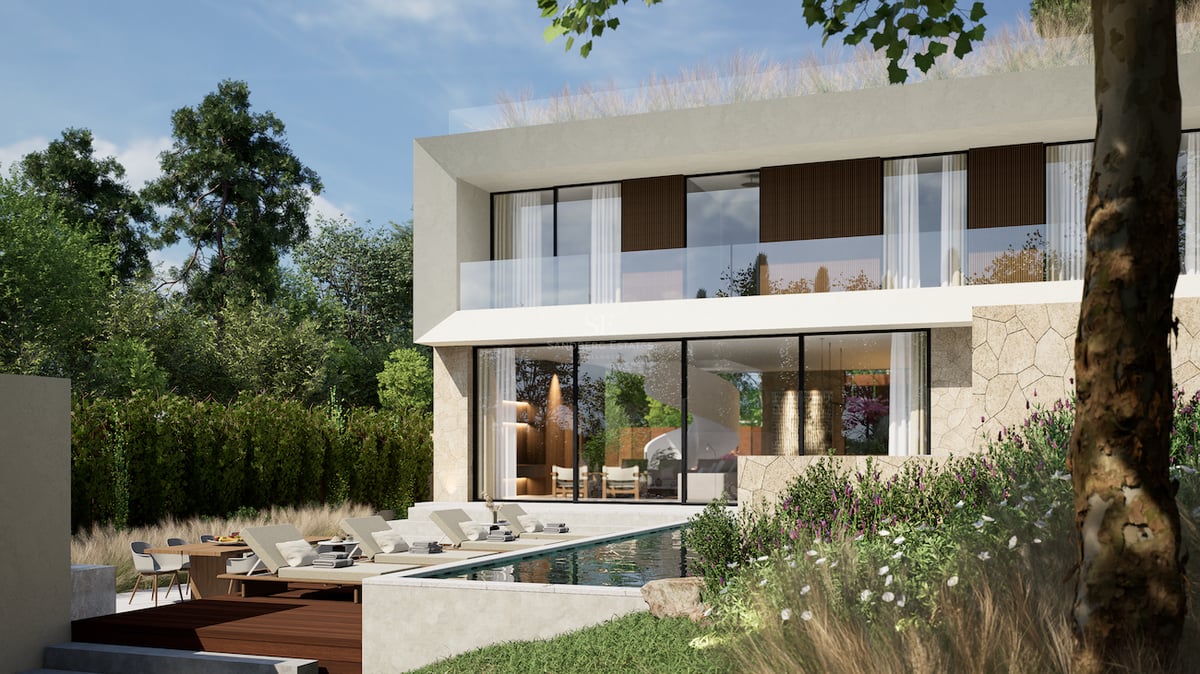 Villa moderne de deux étages avec façade vitrée, murs en pierre, piscine, chaises longues et aménagement paysager.