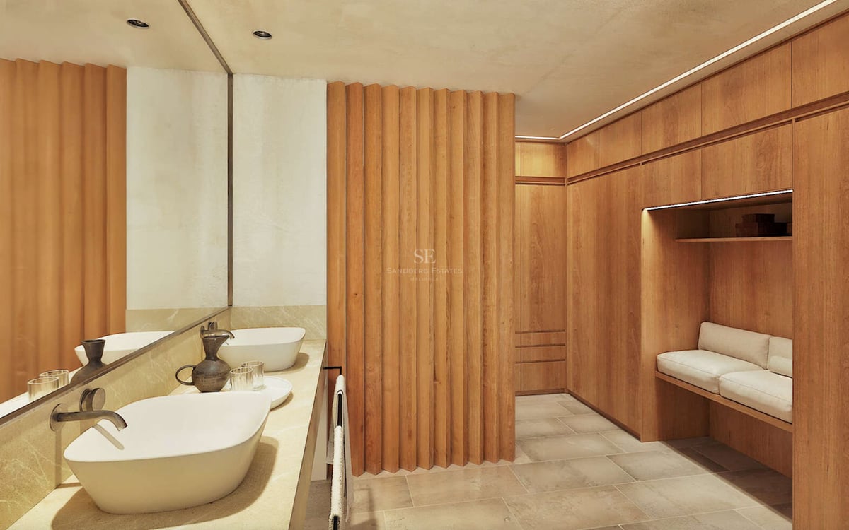 Salle de bain contemporaine avec double vasque blanche et parois en bois cannelé menant à un dressing.