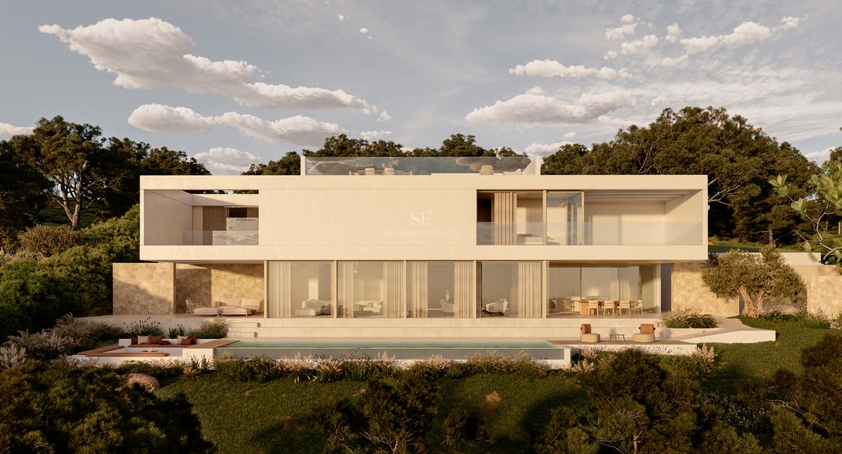Villa moderne à deux étages avec de grandes baies vitrées, murs en pierre et piscine à débordement sous un ciel dégagé.