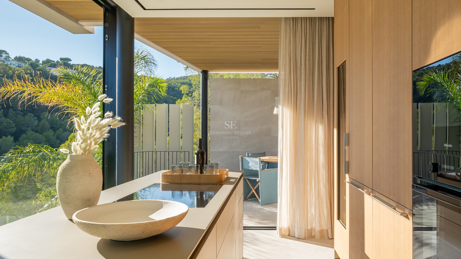 Expansive terrace featuring an infinity pool, ocean views, and modern furniture. Minimalist architecture with high-end finishes.