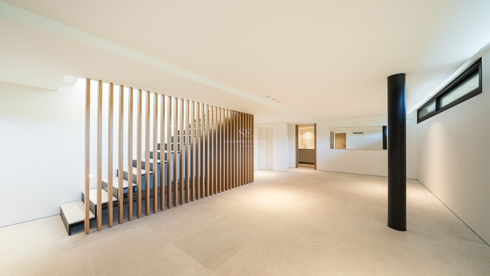 Spacious exterior with swimming pool, outdoor lounge area, sunbeds, and lush greenery. Modern and elegant design.