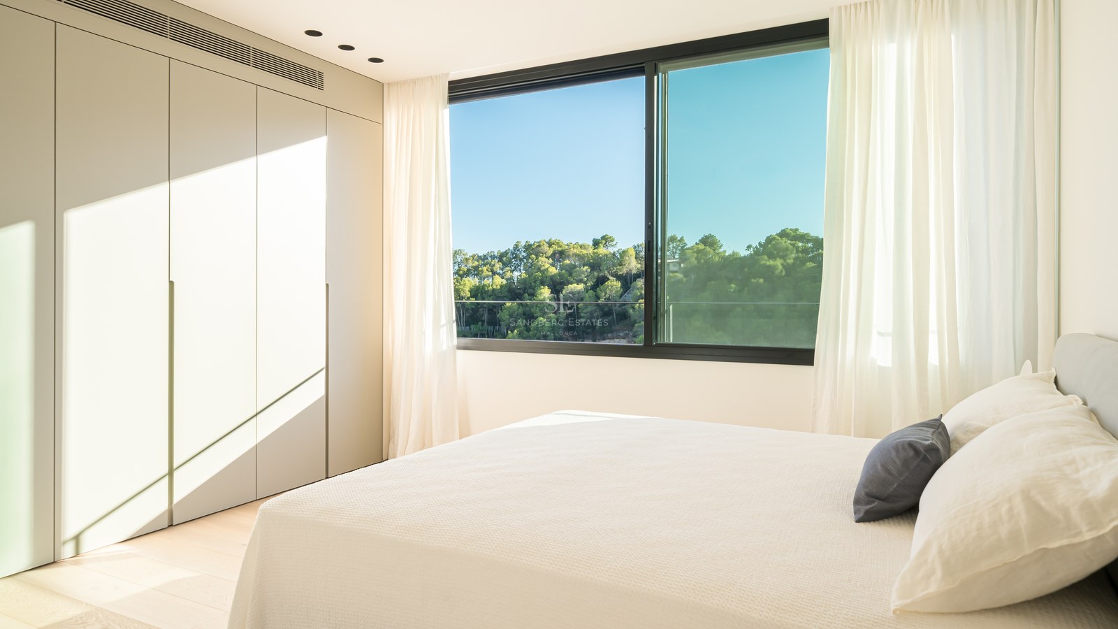 View of a luxurious villa with an infinity pool. Modern architecture, large windows, and manicured landscaping. Elegant and sophisticated design.