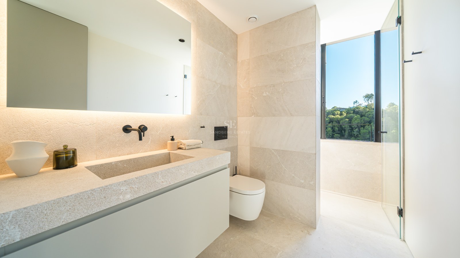 Spacious balcony with panoramic sea views. Modern design, glass railing, and elegant furniture. Bright and airy.