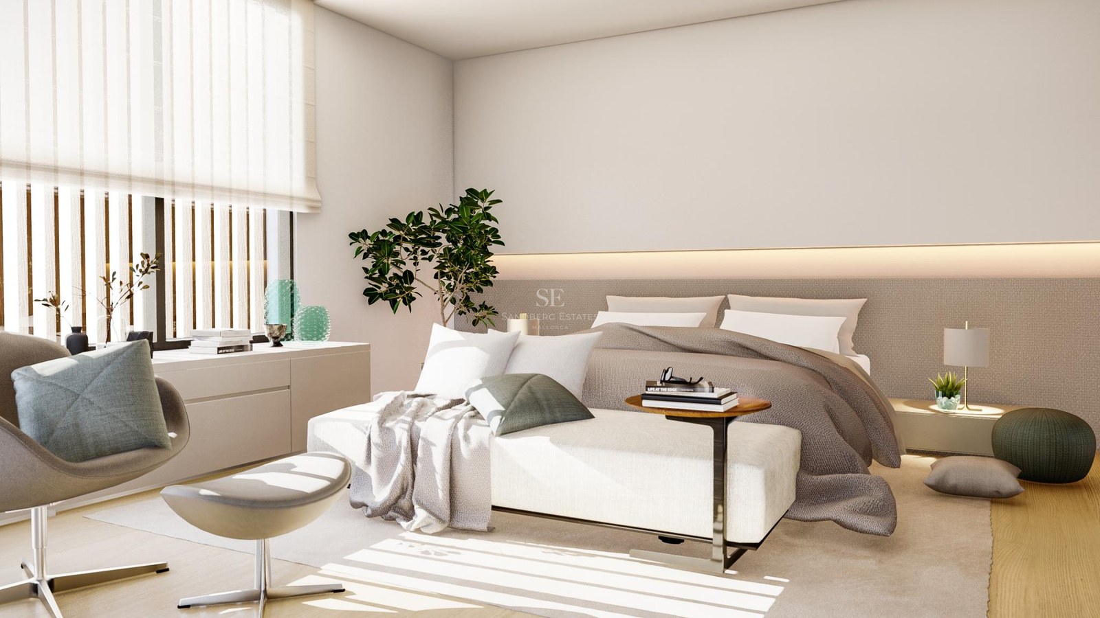 Modern bedroom with large bed, designer lounge chair, and natural light filtered through horizontal blinds.
