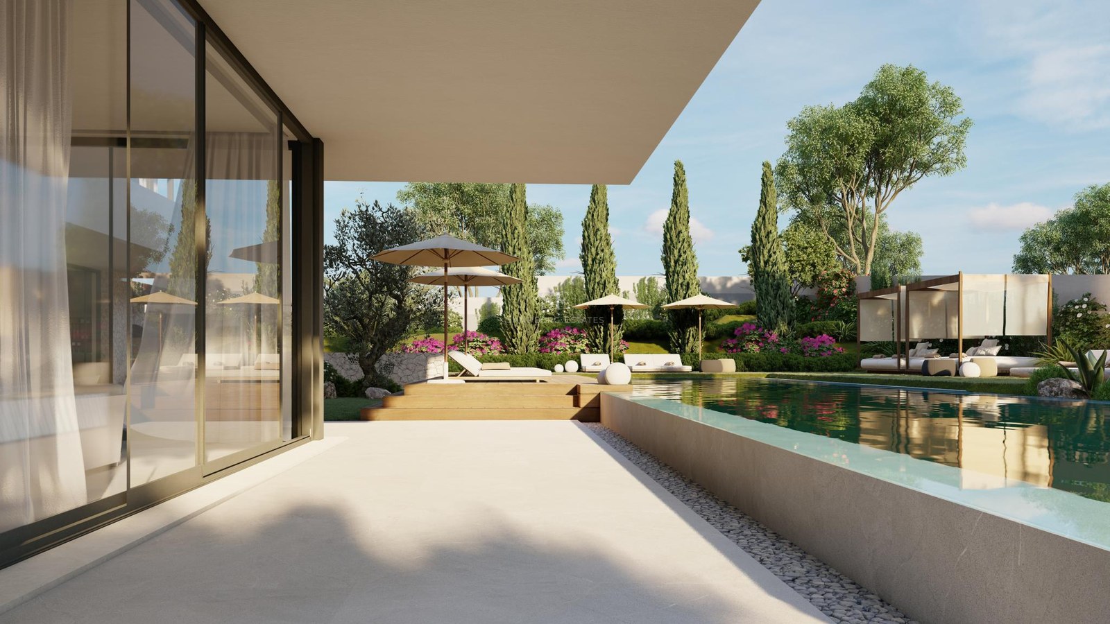 Luxury infinity pool with glass edge, wooden deck, and sun loungers overlooking a landscaped Mediterranean garden.