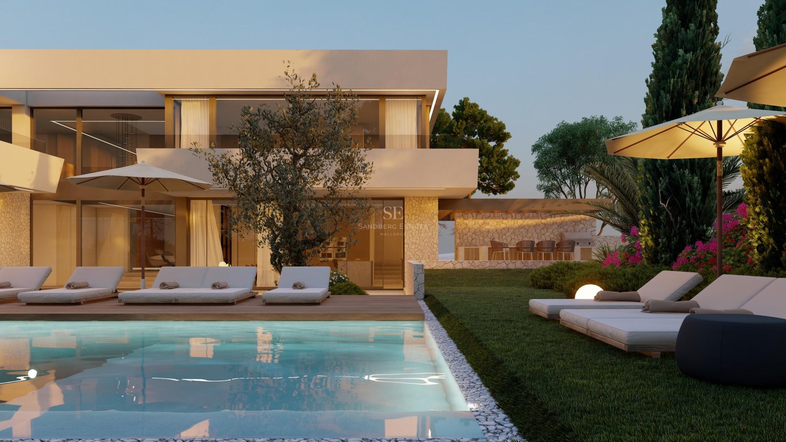 Luxury swimming pool and sun loungers in front of a modern two-story villa with natural stone walls at sunset.