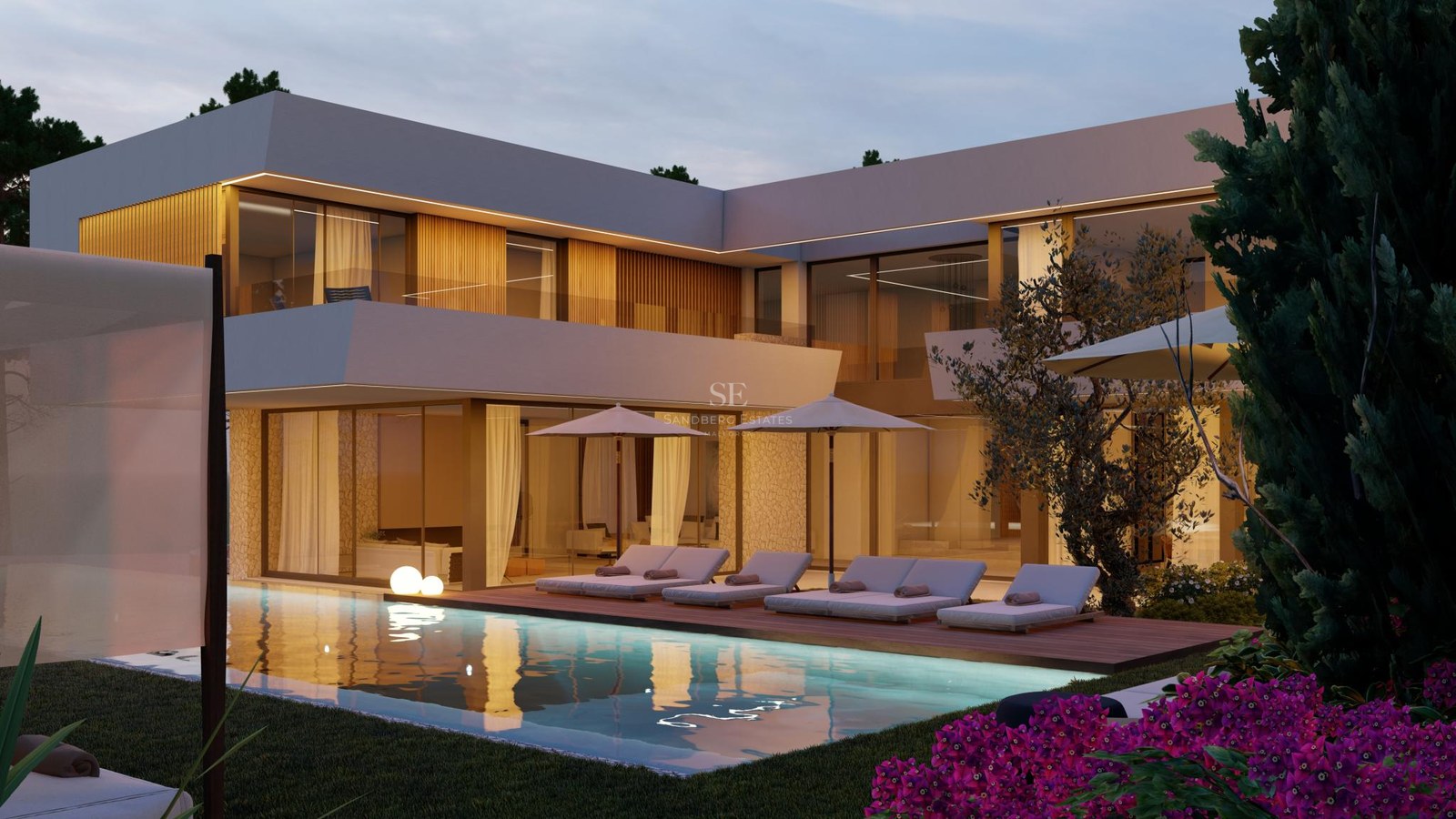 Contemporary two-story villa at twilight featuring an illuminated swimming pool, wooden deck, and glass walls.