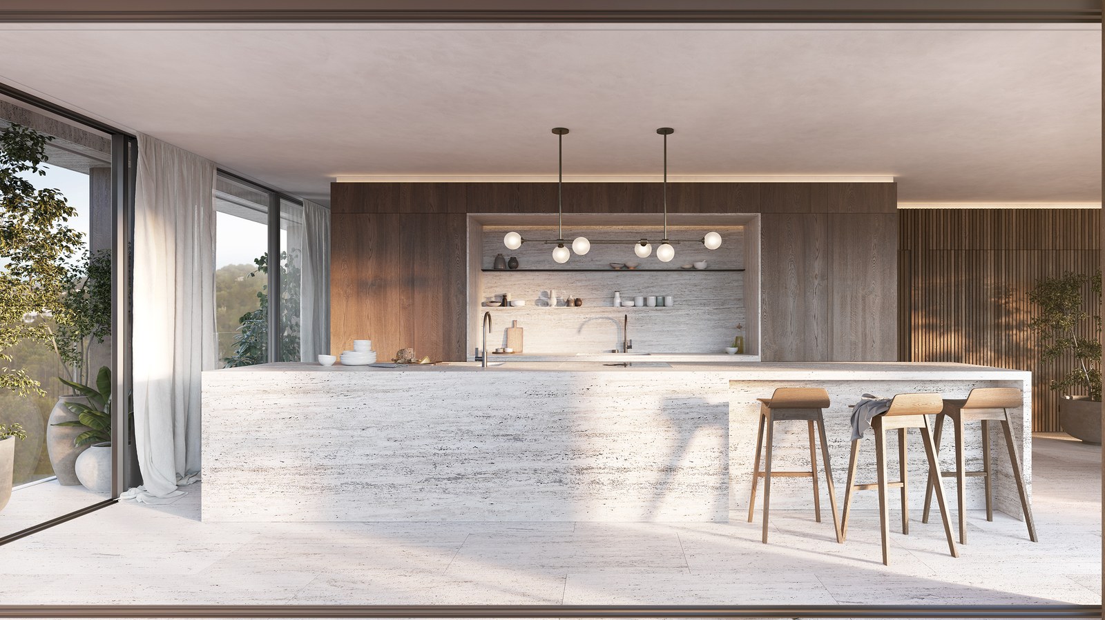 A large travertine kitchen island with wooden stools in a modern open-plan space with floor-to-ceiling windows.