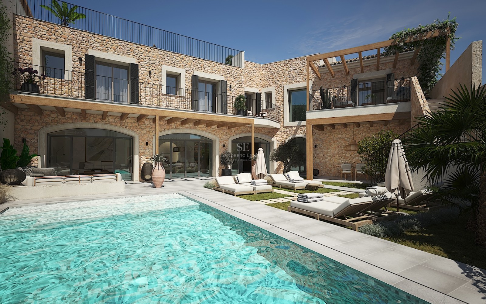 Luxury villa exterior featuring a turquoise swimming pool, natural stone walls, and elegant sun loungers under pergolas.