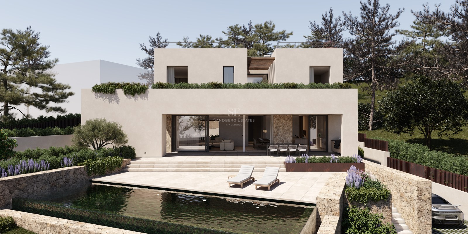 Villa contemporaine de deux étages avec piscine, accents en pierre et jardins paysagers sous un ciel dégagé.