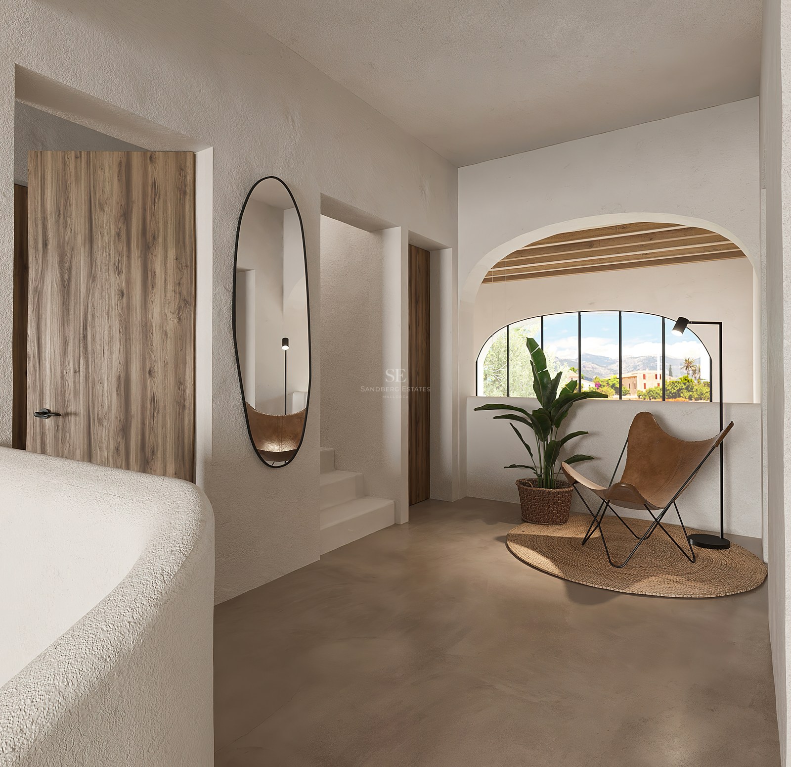 Couloir moderne avec murs texturés, chaise en cuir, miroir ovale et fenêtre voûtée avec vue sur la montagne.