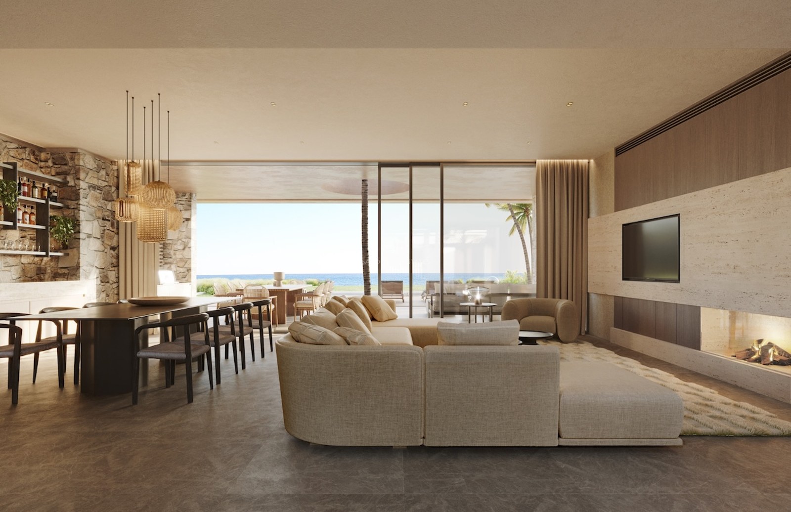 Grand salon contemporain avec canapé neutre, cheminée intégrée et baies vitrées donnant sur la mer.
