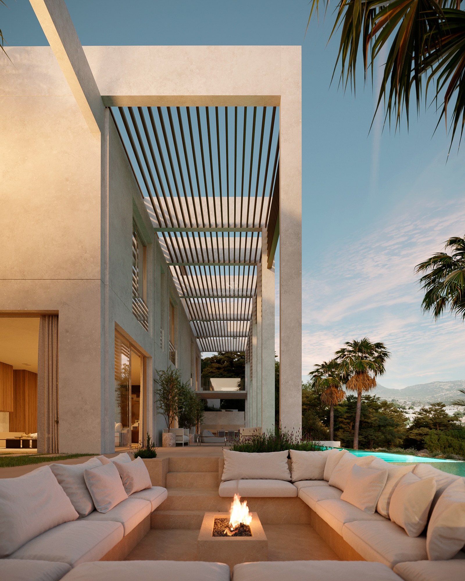 Luxury outdoor terrace featuring a sunken seating area with a fire pit, a slatted pergola, and a pool with mountain views.