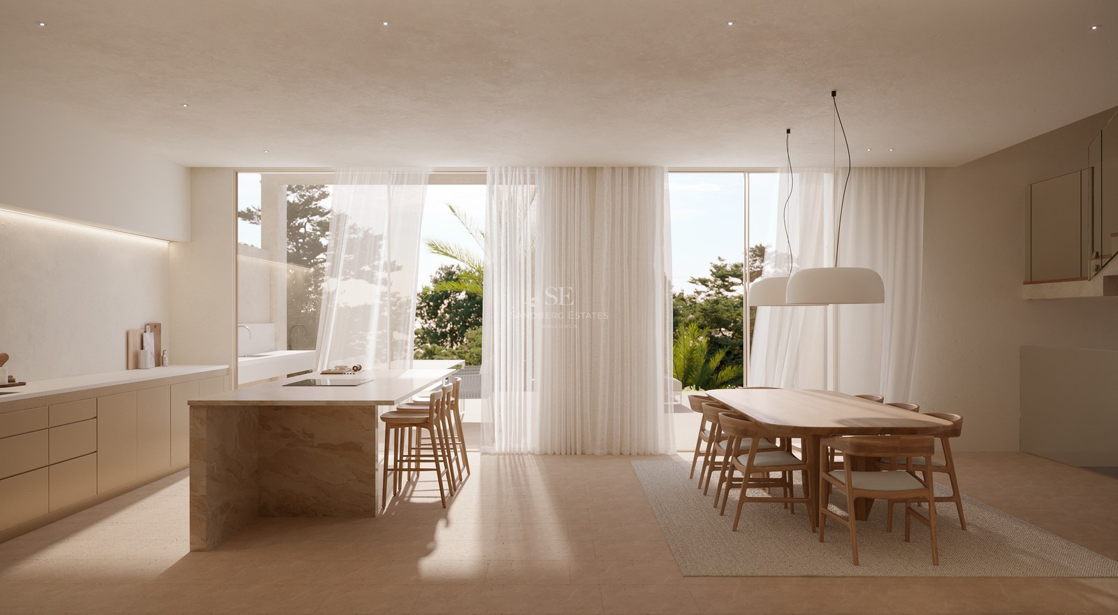 Bright kitchen with stone island, wooden dining set, and sheer curtains opening to a lush garden.