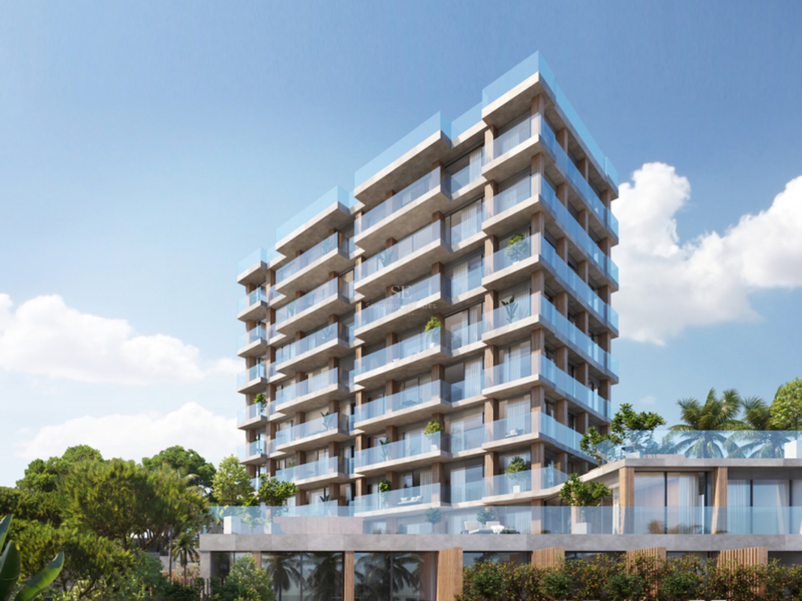 Exterior view of a modern multi-story apartment building with glass balconies and natural stone textures.