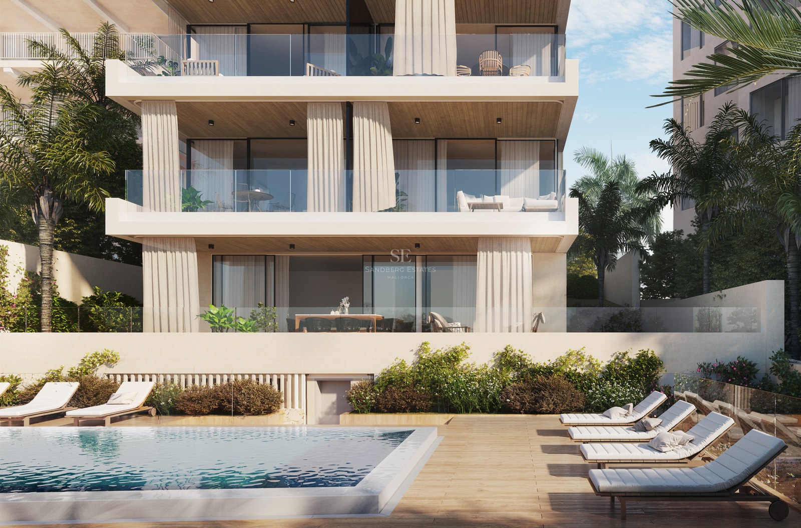Luxury apartment building facade with a swimming pool, wooden deck with sun loungers, and multi-level glass terraces.