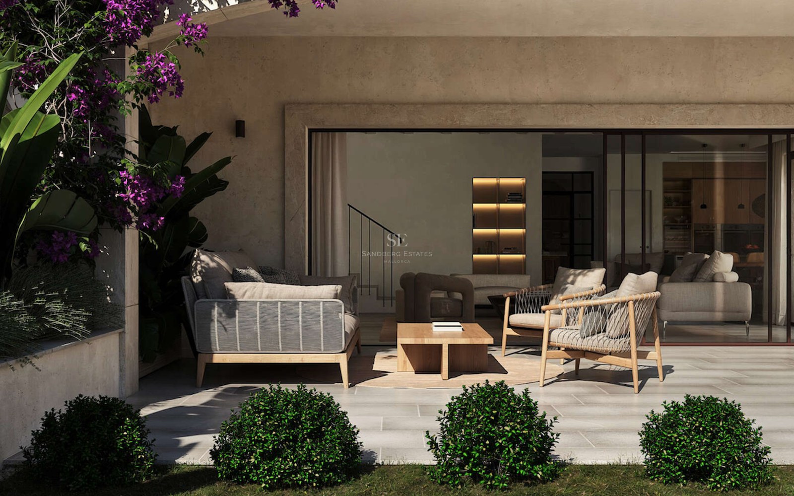 Terrasse moderne couverte avec mobilier haut de gamme, sol en pierre et vue sur un intérieur ouvert.