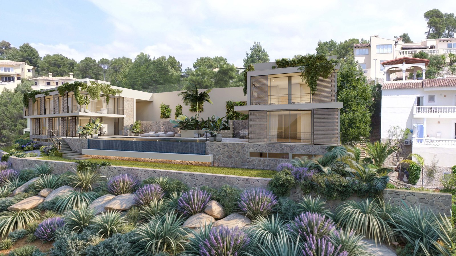 Villa moderne sur deux niveaux avec murs en pierre, grandes baies vitrées et piscine à débordement.