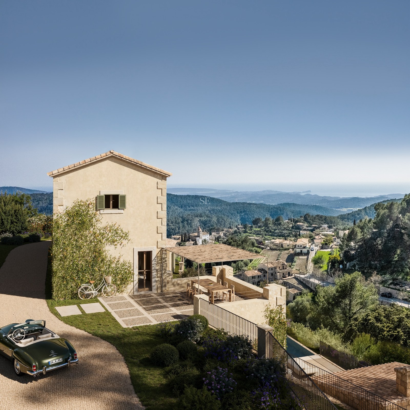 Villa en pierre sur une colline surplombant une vallée et la mer avec une voiture décapotable classique sur le chemin.