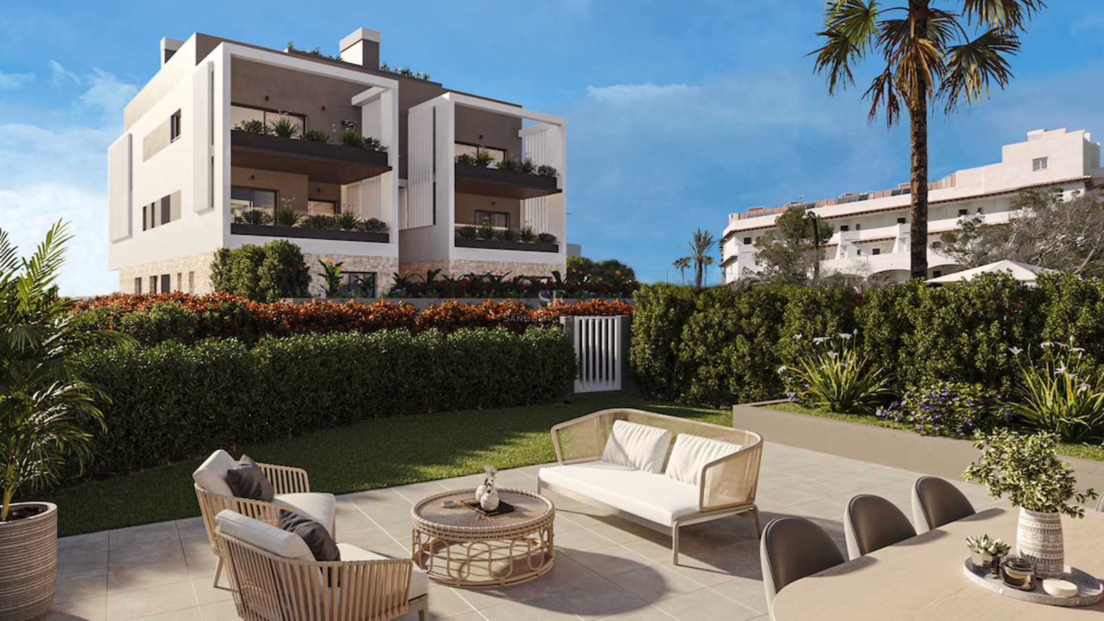 Contemporary outdoor terrace with lounge furniture and dining area overlooking a manicured lawn and modern building.