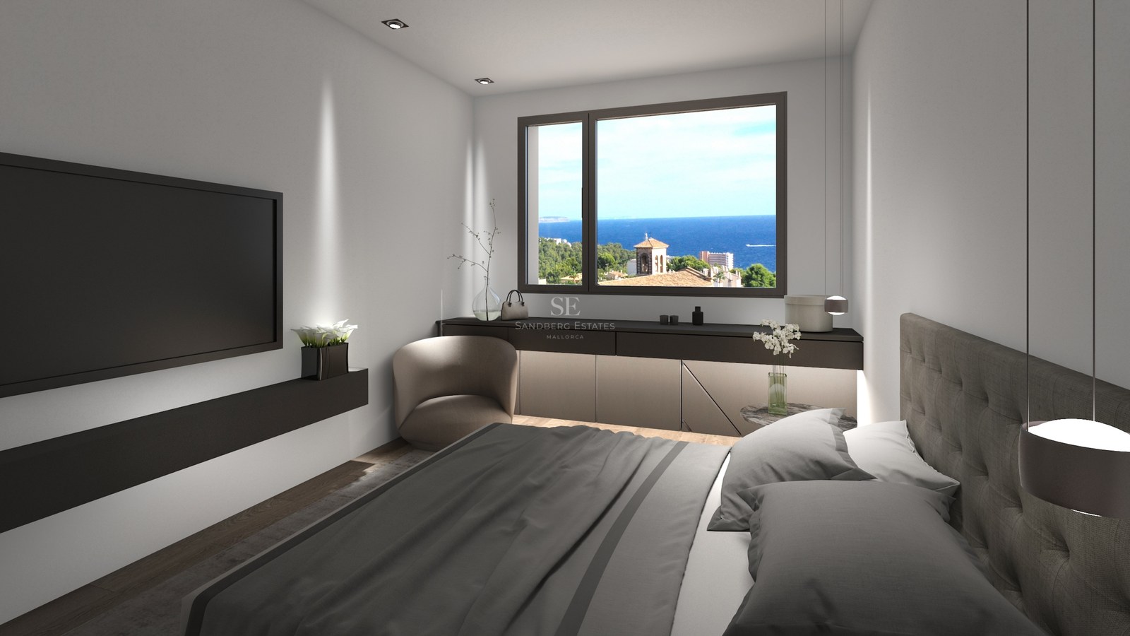 Chambre moderne avec lit gris, TV murale et fenêtre offrant une vue sur la mer bleue et le paysage côtier.