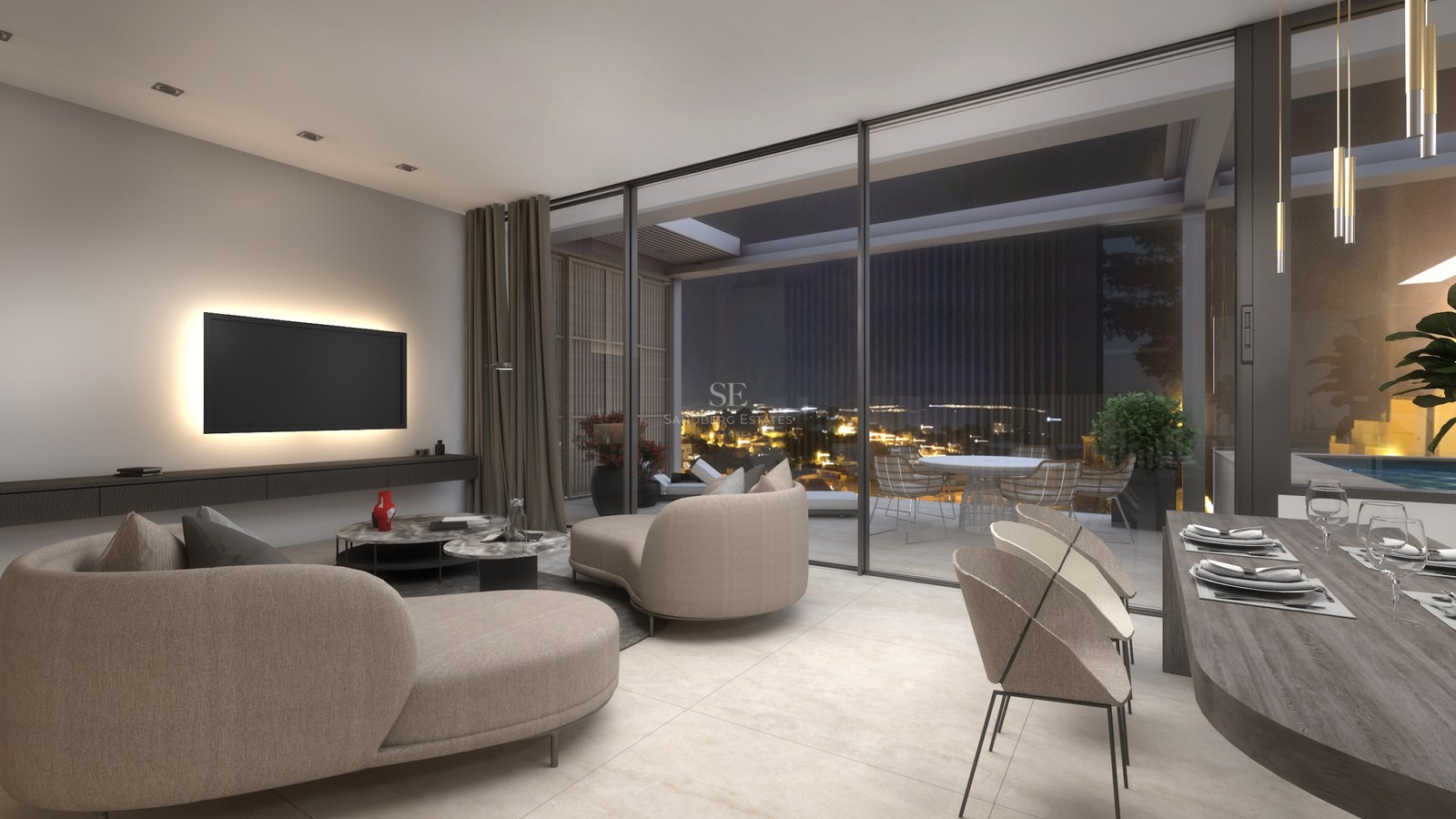 Salon de luxe avec canapés beiges, grandes baies vitrées et terrasse donnant sur les lumières de la ville la nuit.