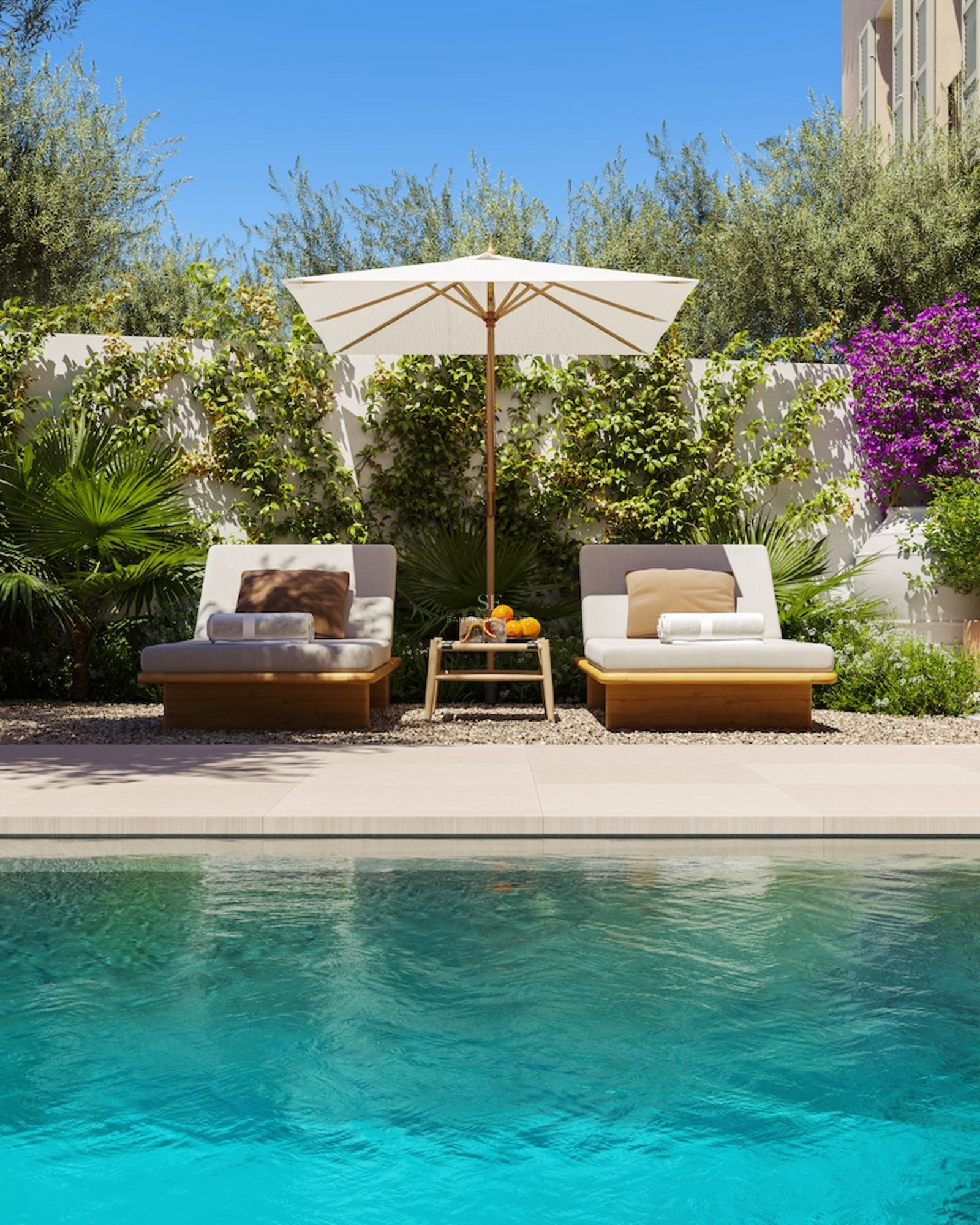 Two elegant wooden sun loungers under a white parasol next to a turquoise pool with lush green foliage.