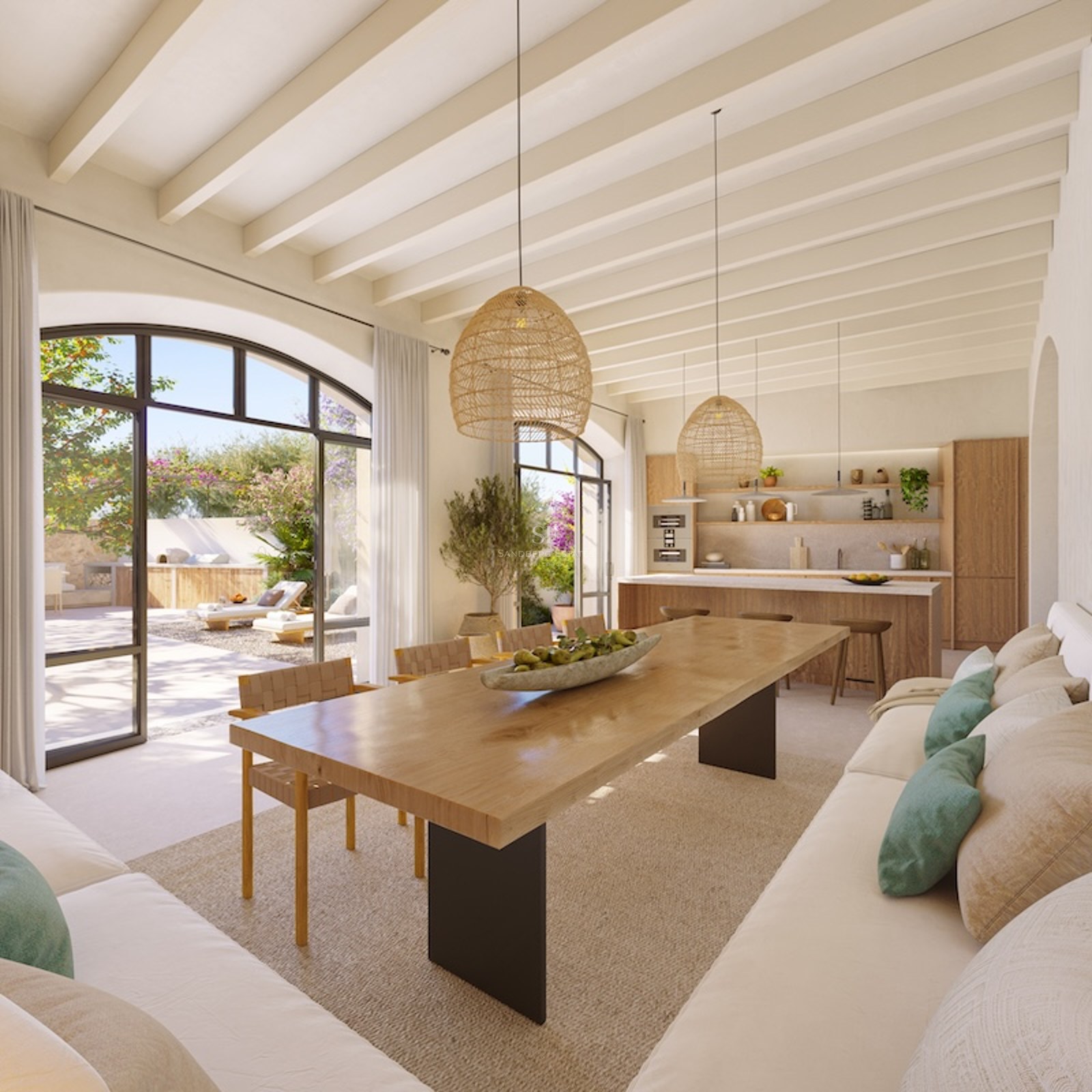 Open-concept living space with wood table, white sofas, and large arched windows facing a sunny garden.