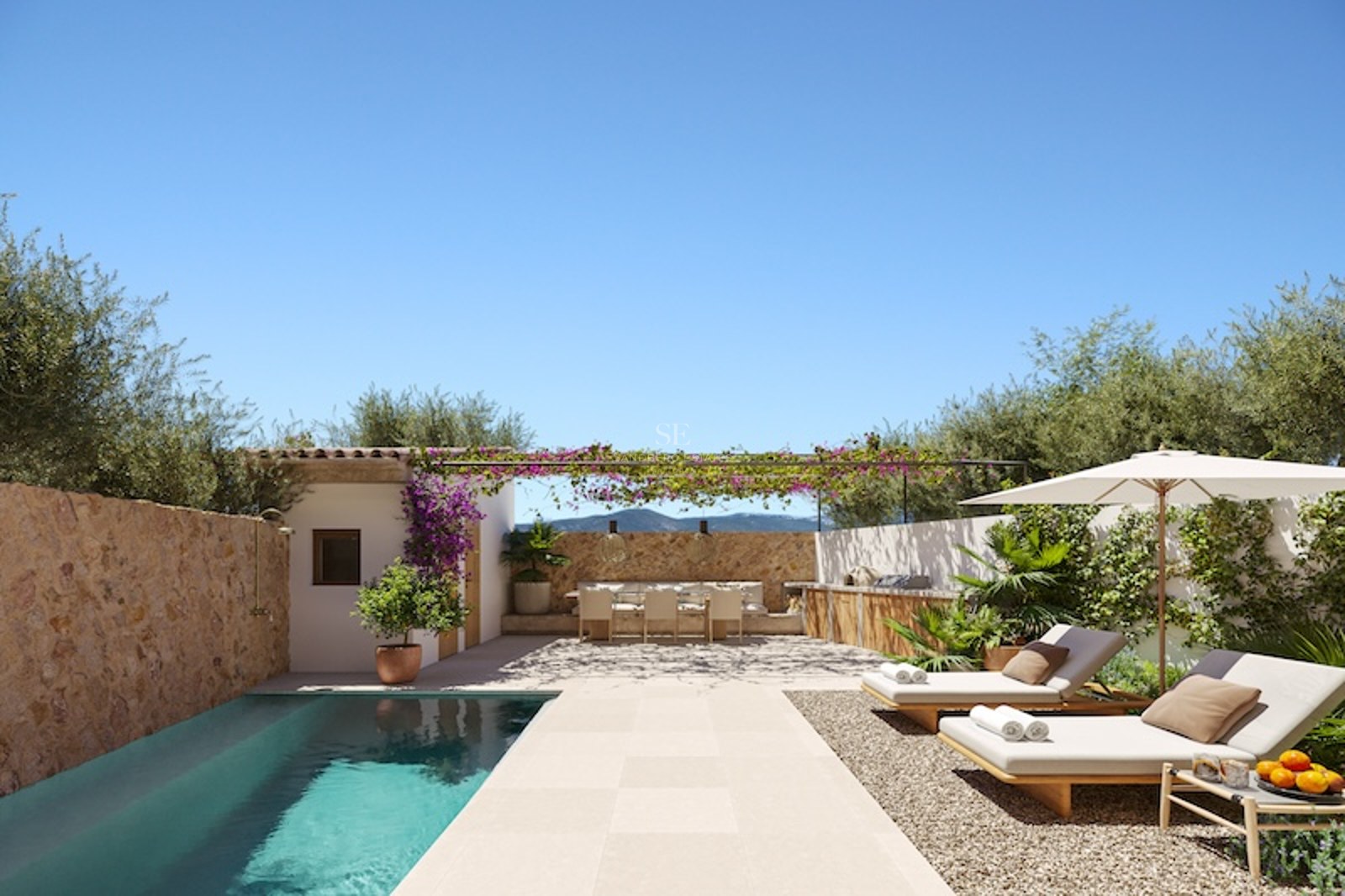 Modern turquoise pool with wooden sun loungers, outdoor dining under a flowering pergola, and rustic stone walls.