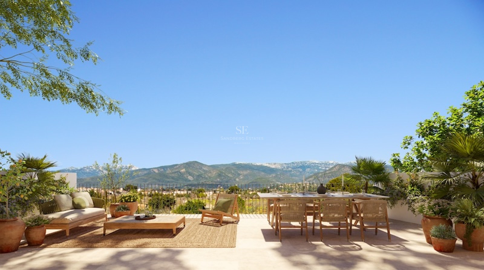 Spacious sun-drenched terrace with wooden furniture, dining area, and stunning views of distant mountains.