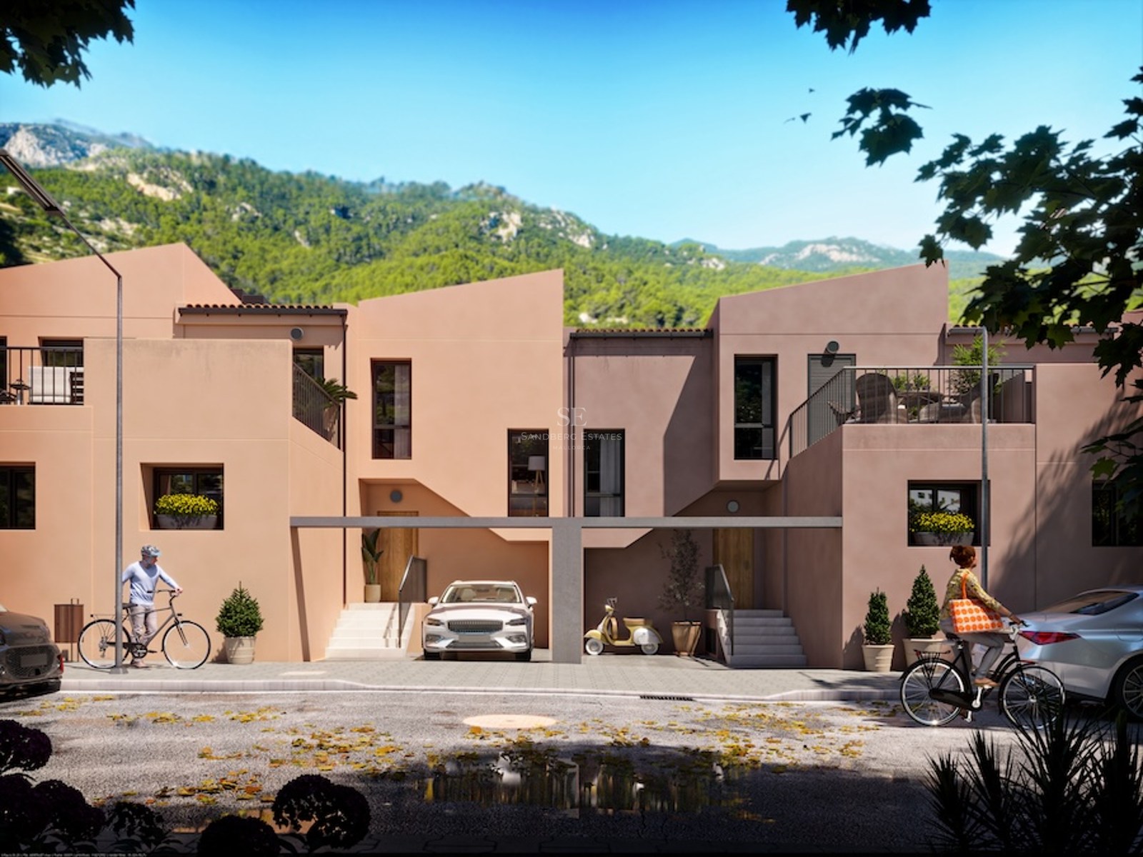 Contemporary terracotta-colored townhouses against a lush mountain backdrop with people cycling on the street.