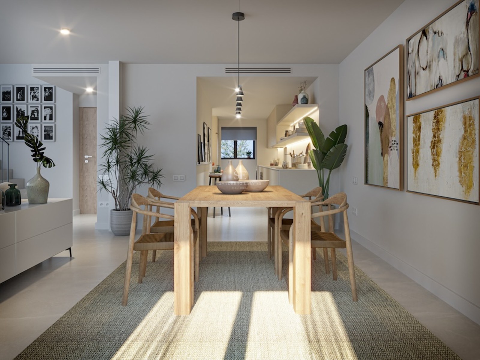 Bright dining area with light wood table, designer chairs, woven rug, and large abstract wall art.