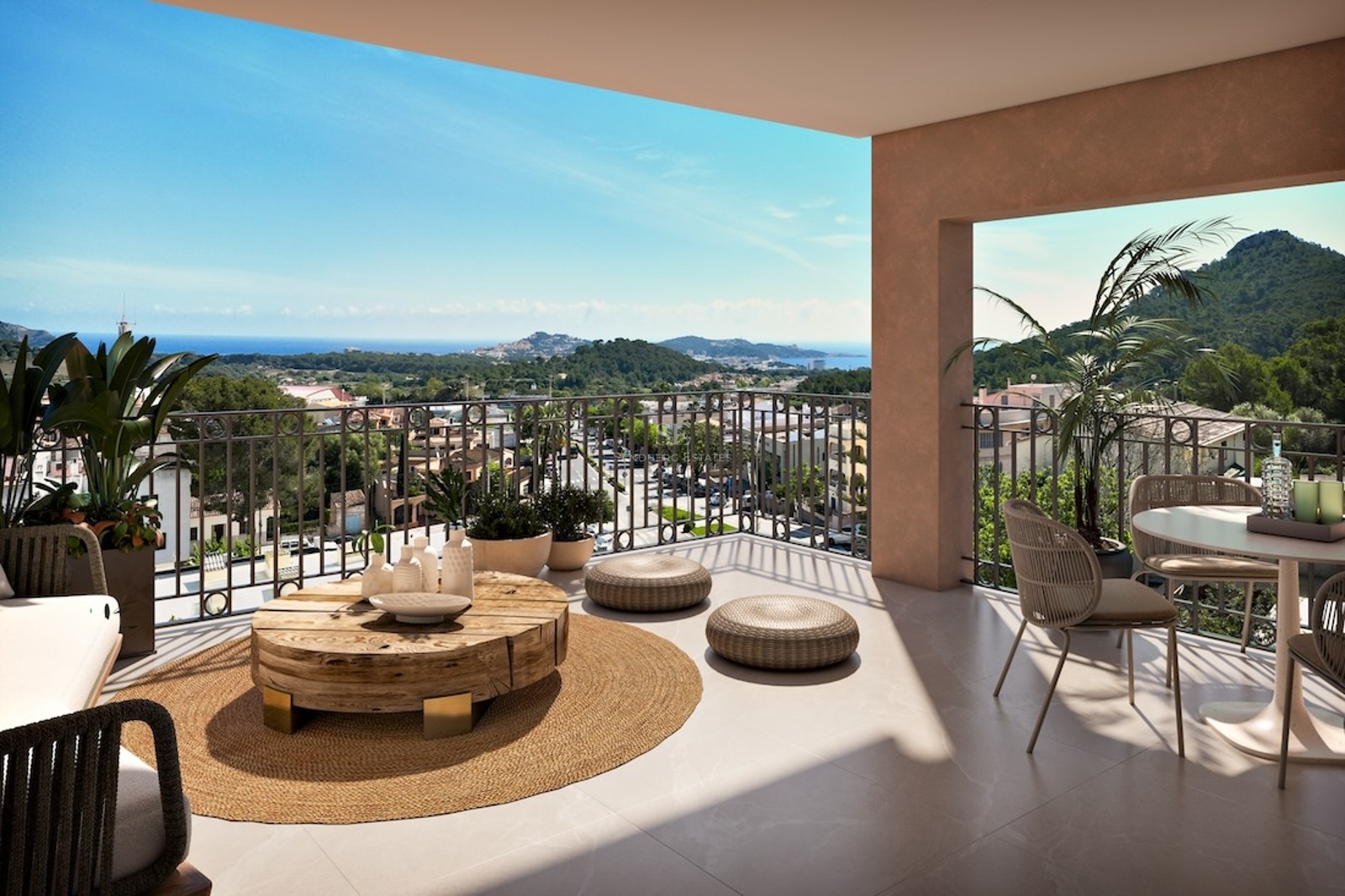 Spacious modern terrace with wicker furniture, a wooden coffee table, and a wide view of the sea and green mountains.