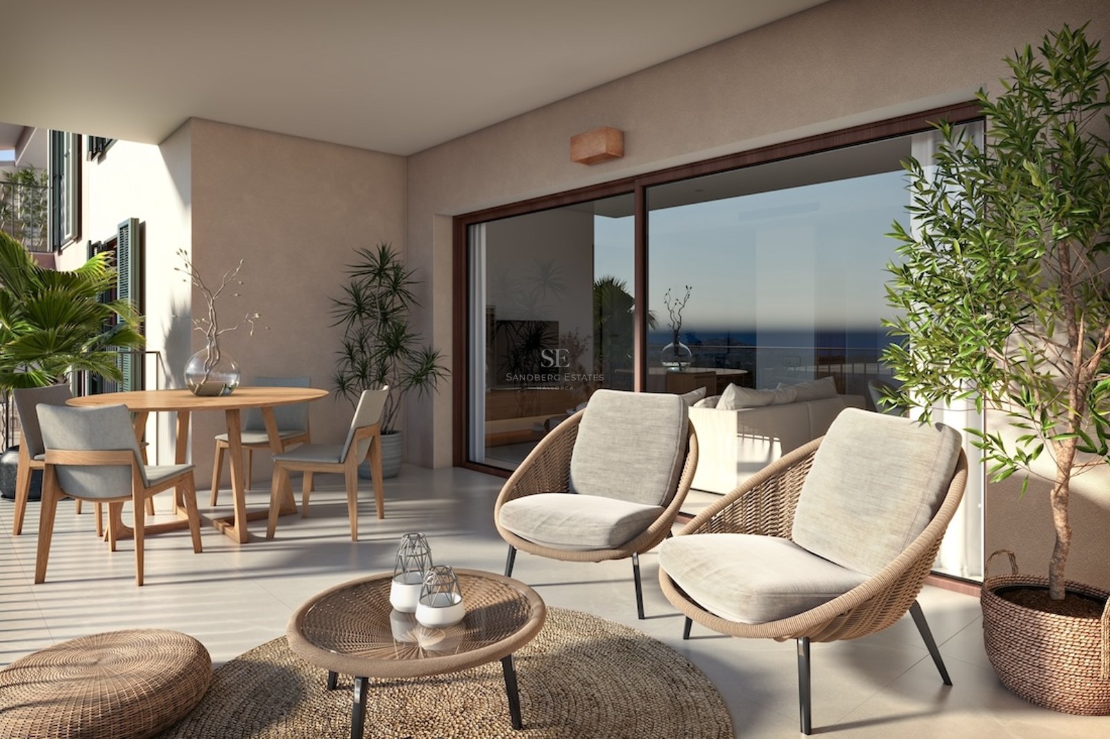 Modern terrace with woven lounge chairs, wooden dining table, and large glass doors reflecting a sea view.