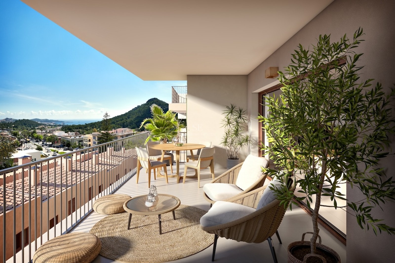 Spacious terrace featuring wicker furniture, outdoor dining area, and panoramic views of the sea and mountains.