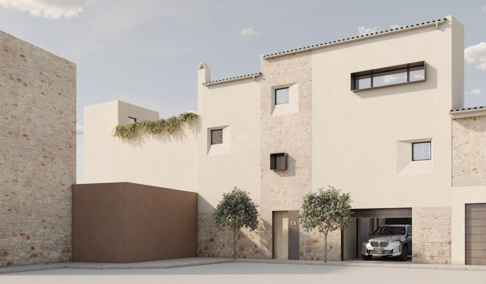 Modern stone and stucco building with minimalist windows and a car in the garage under bright daylight.