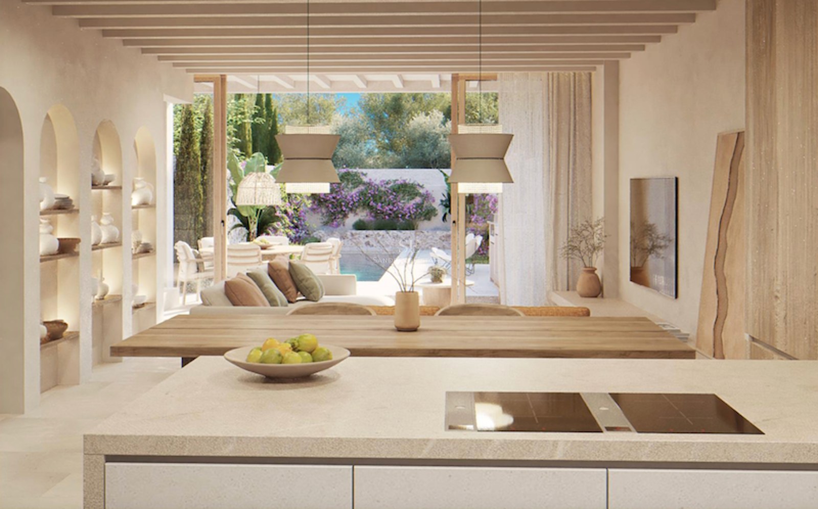 Open-plan space with a kitchen island, wooden beams, and views of a terrace with a pool and garden.