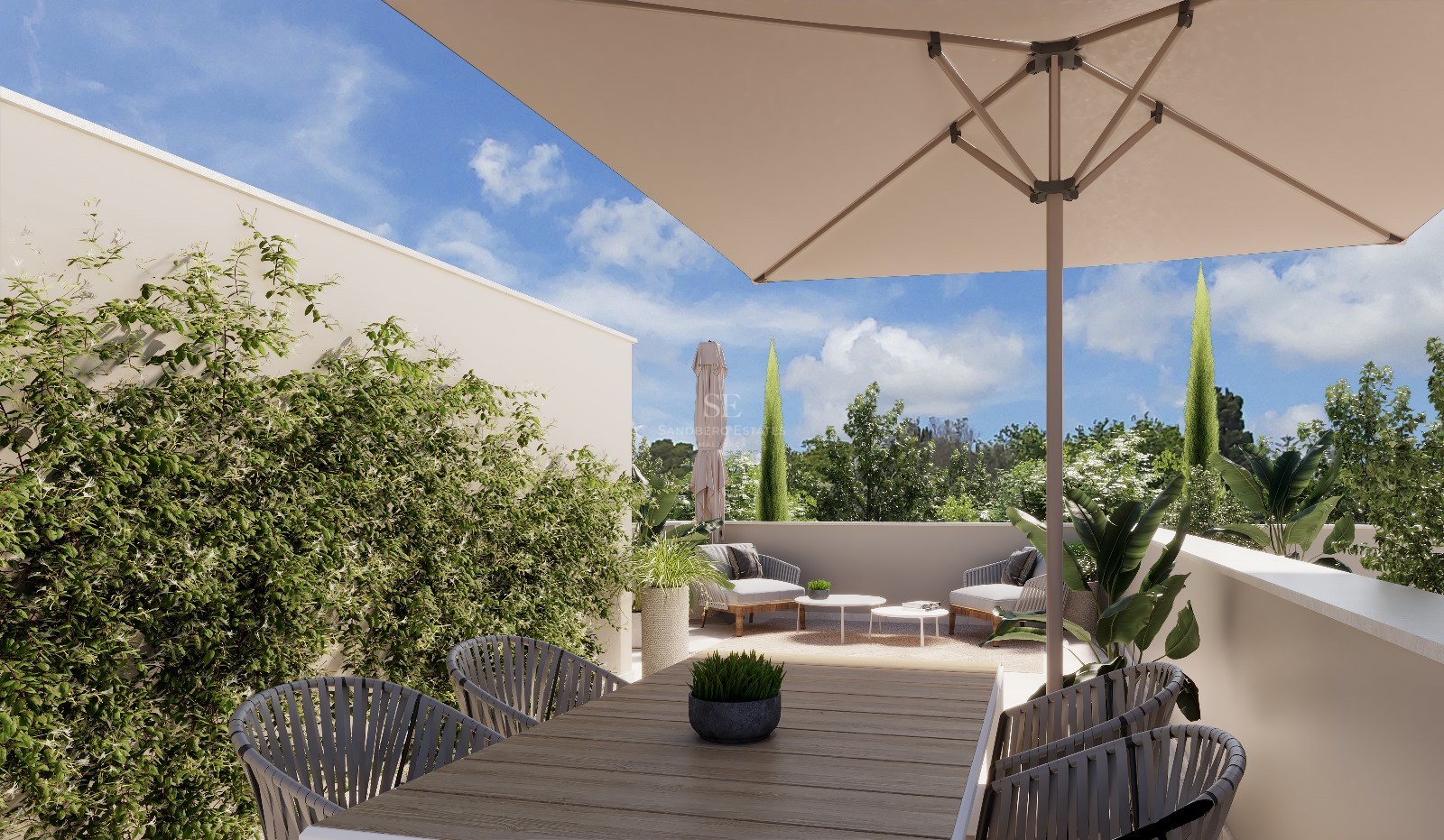 Bright outdoor terrace with a wooden dining table, large sun umbrella, lounge chairs, and lush green plants.