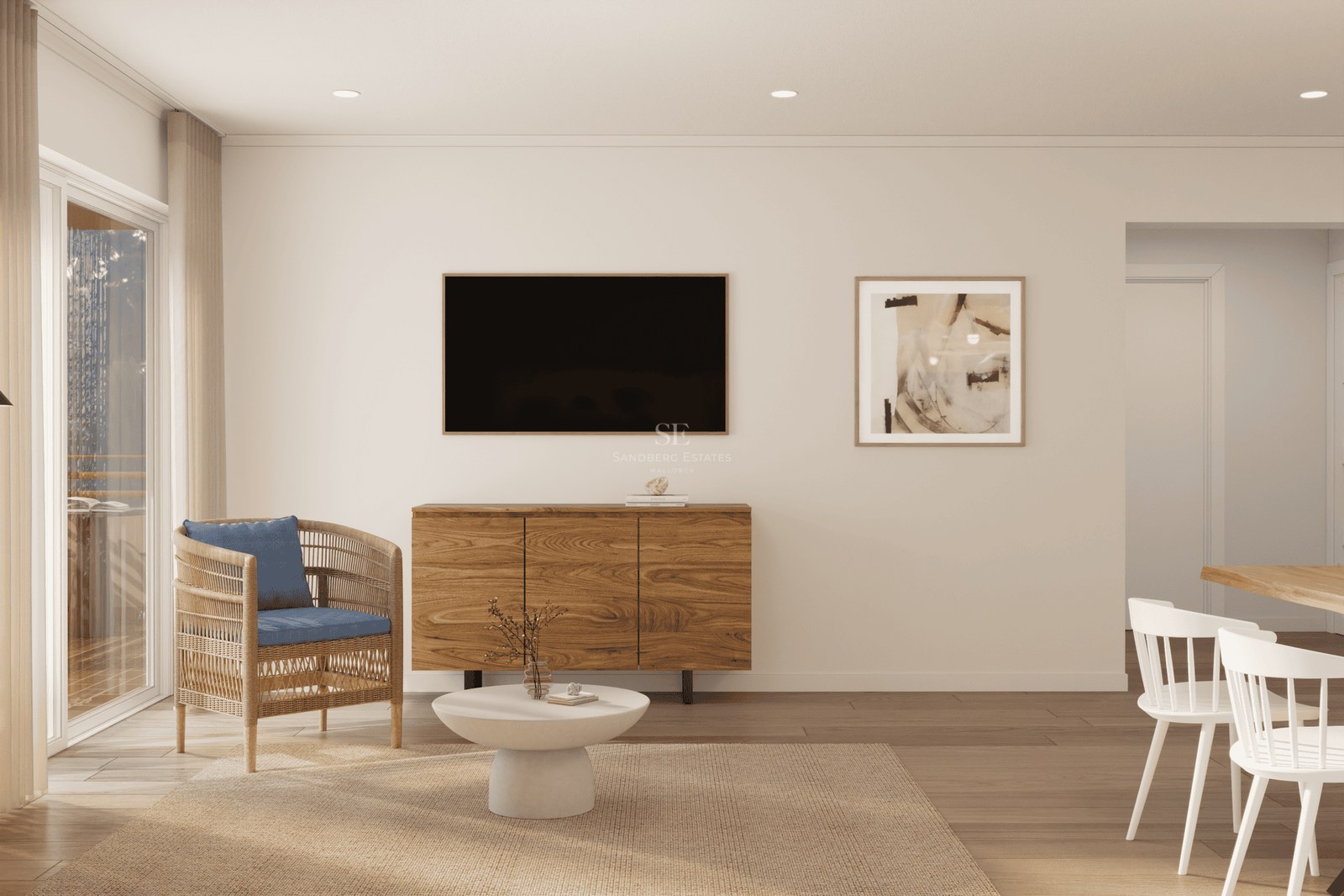Modern living area with wooden sideboard, TV, wicker armchair with blue cushion, and bright dining corner.