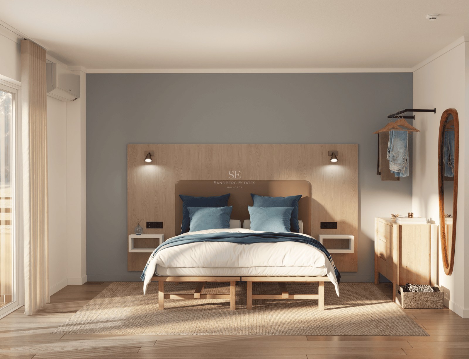 A bright master bedroom with a large bed, wooden headboard, blue pillows, and sunlight through a window.