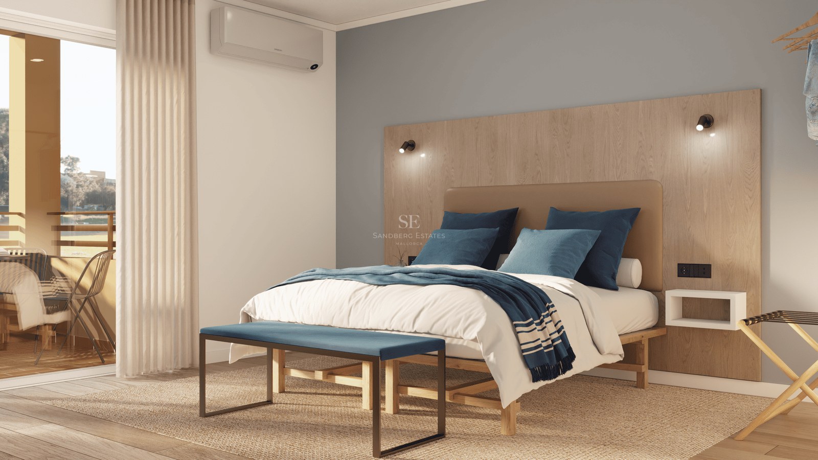 Bright bedroom featuring a double bed, wooden headboard, and access to a sunny balcony.