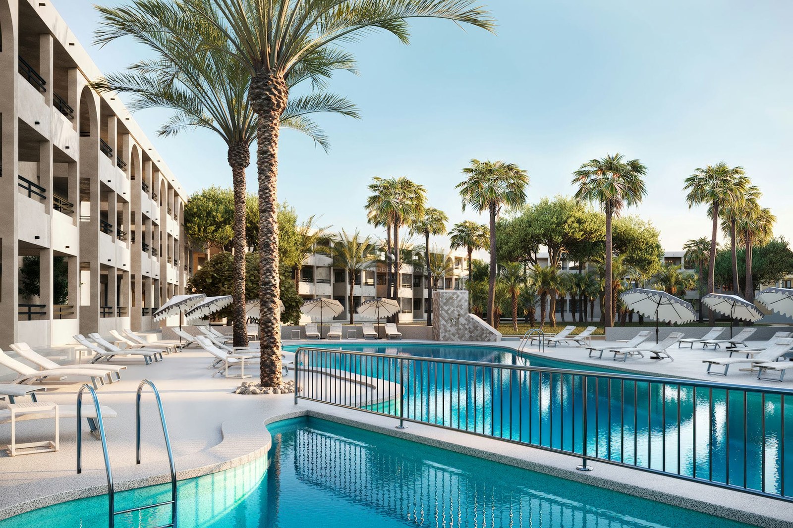 Large turquoise swimming pool surrounded by white sun loungers and tall palm trees in front of a modern building.