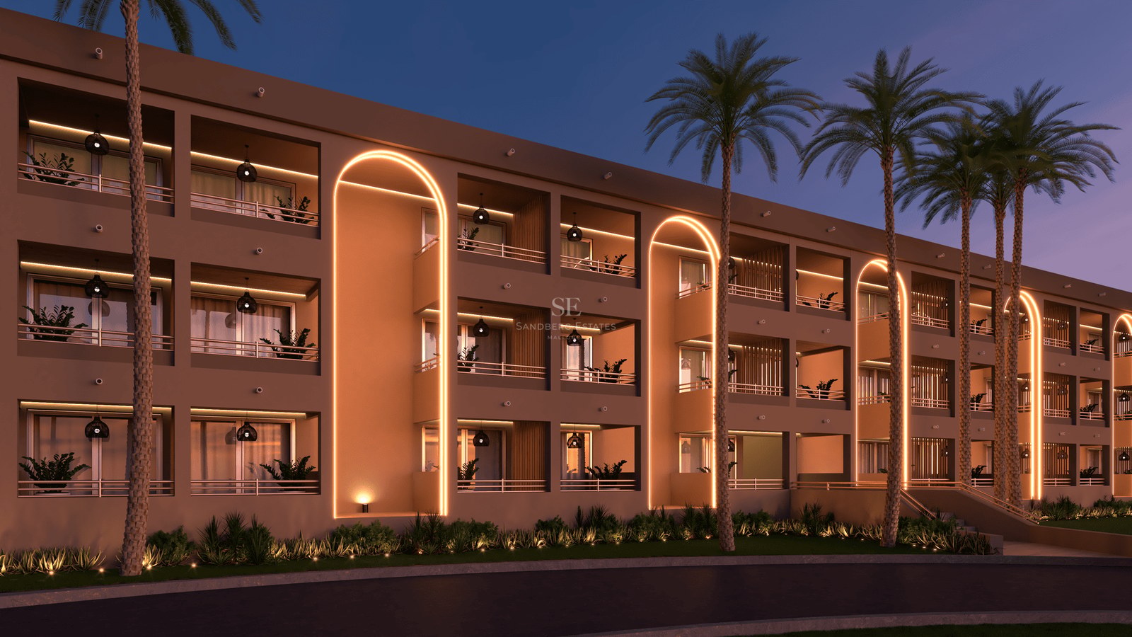 Modern building featuring illuminated golden arches, private balconies, and tall palm trees under a dusk sky.