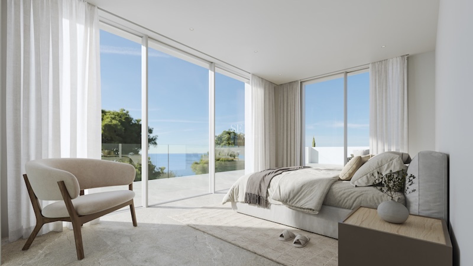 Ett minimalistiskt master bedroom med glasdörrar från golv till tak som leder ut till en stenterrass med utsikt över havet.