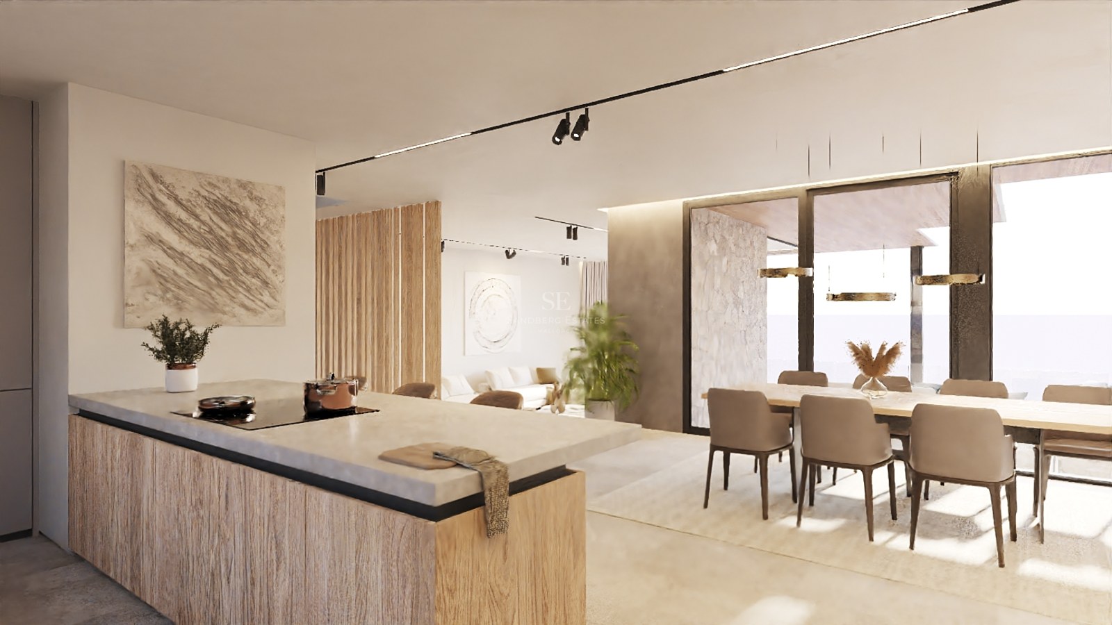 Cuisine moderne à aire ouverte avec îlot en pierre, menuiseries en bois et salle à manger baignée de lumière naturelle.