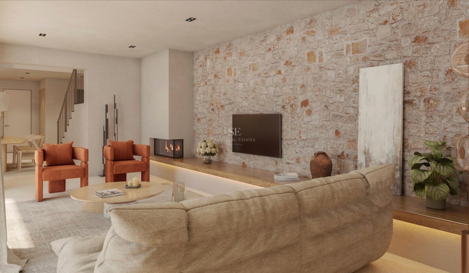 Salon moderne avec mur en pierre apparente, fauteuils orange, canapé beige et cheminée intégrée.
