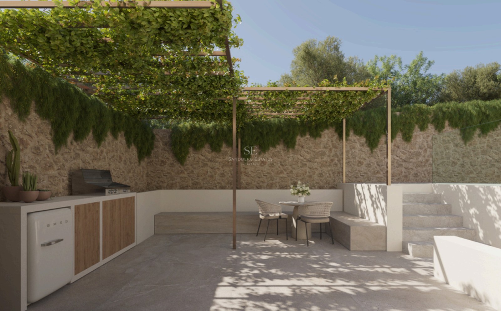 Modern outdoor patio with a natural stone wall, climbing plants on a pergola, integrated dining area and kitchenette.