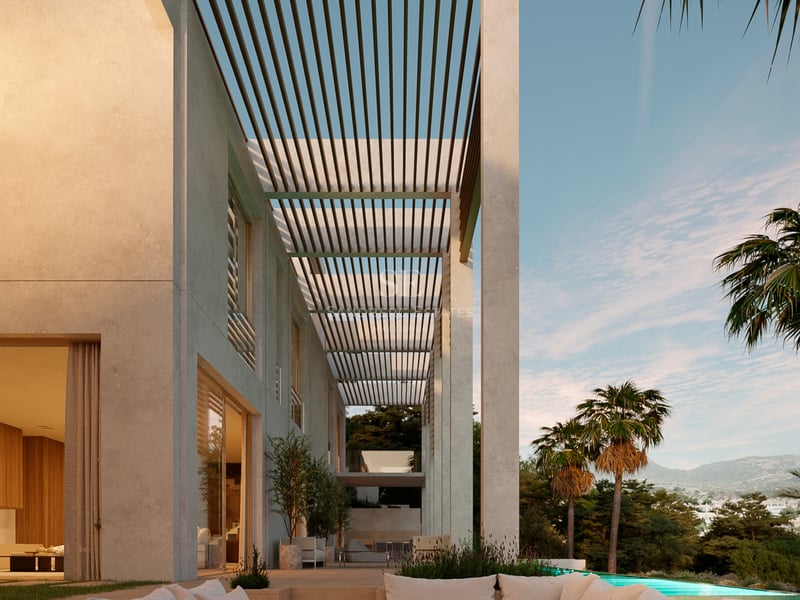 Terrasse de luxe avec salon encastré, brasero central, pergola à lames et piscine avec vue sur la montagne.