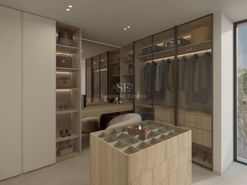 Dressing moderne avec menuiseries en bois clair, armoires vitrées, îlot central pour bijoux et coiffeuse.